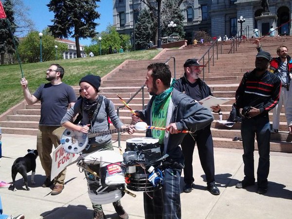 Photographs of musicians playing at Denver’s May Day