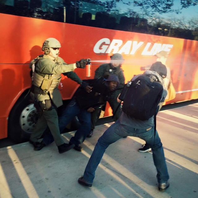 Denver police arrest a man while pepper spraying photographers